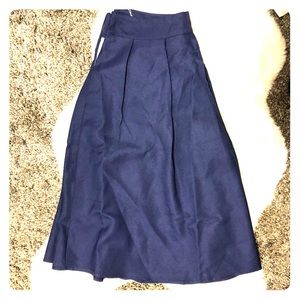 Navy blue calf length skirt.